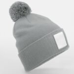 Beechfield AppliquÃ Patch Pom Beanie HEADWEAR - Beanie Hat | Xcel UK