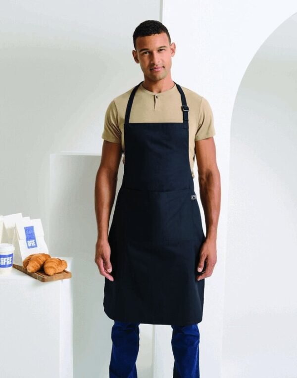 Premier Workwear FAIRTRADE AND ORGANIC CERTIFIED COTTON BIB APRON — Custom Embroidery Available